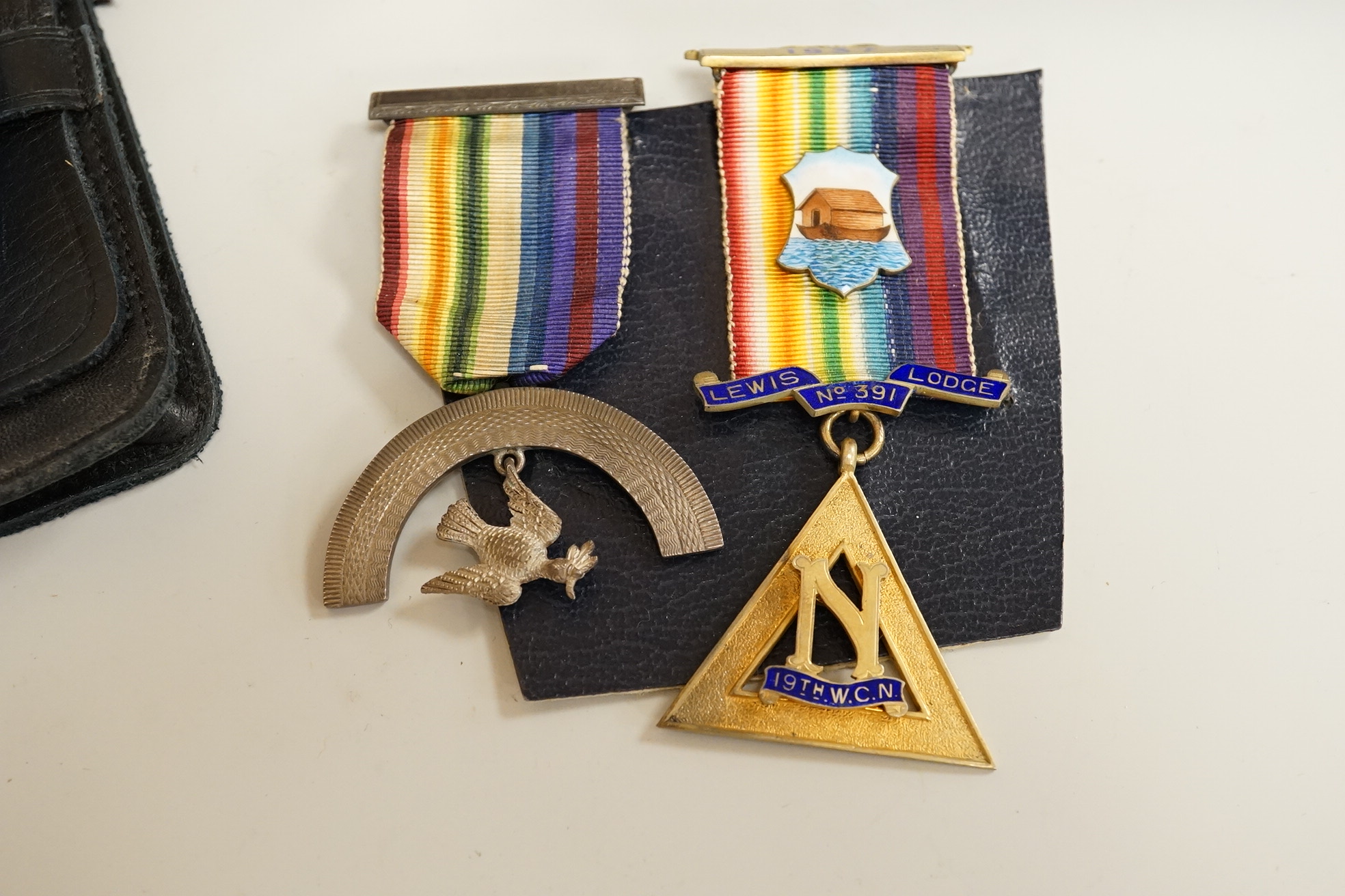 Masonic collectables including three paperweights, a cigarette box and two ribboned medals